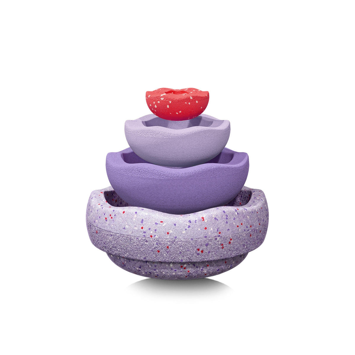 A set of four nested, scallop-edged Stapelstein pieces in shades of purple with a speckled texture, topped with a small red piece on a white background.