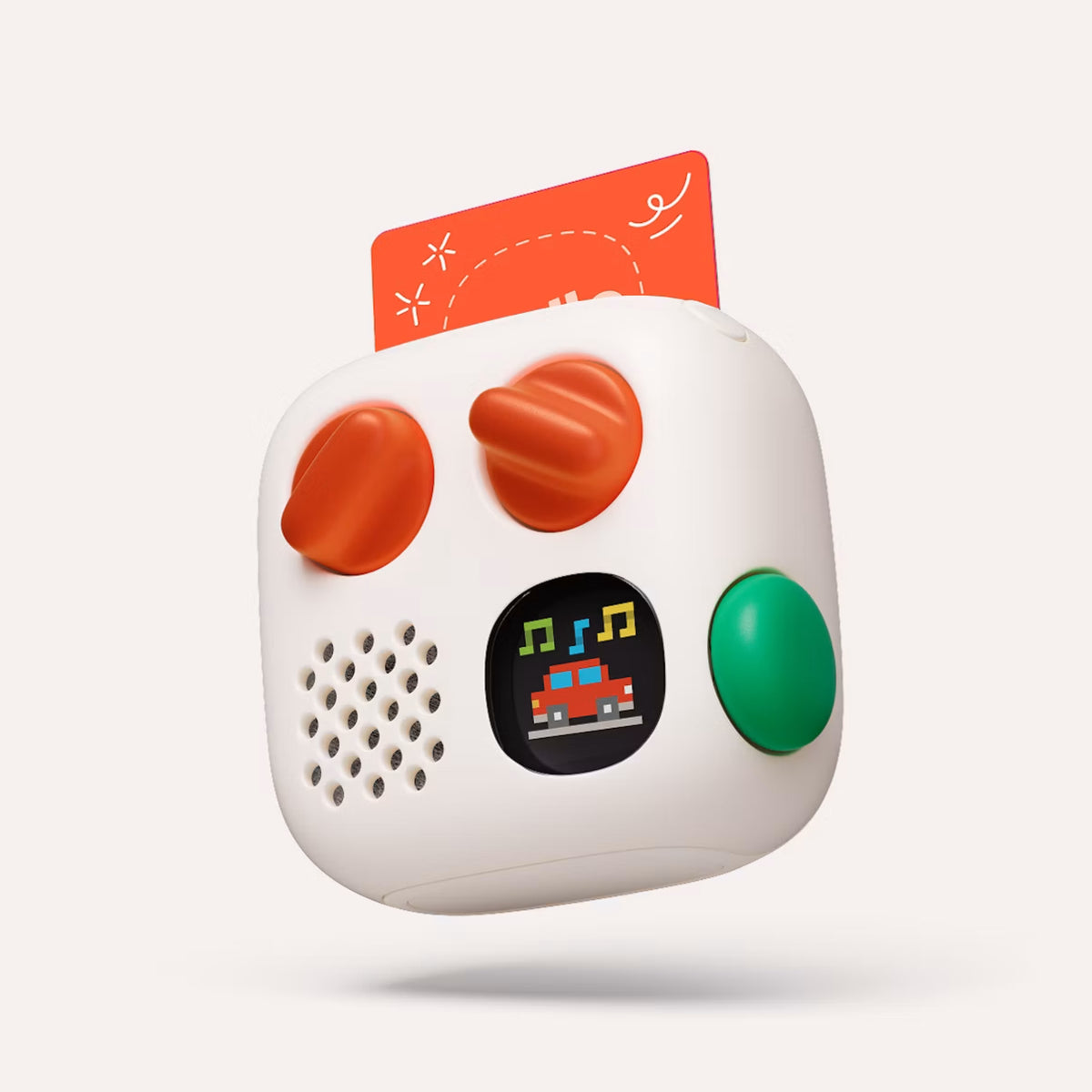 A white Yoto 4th Gen Mini Player with orange knobs, a green button, and a small card, shown floating against a white background.