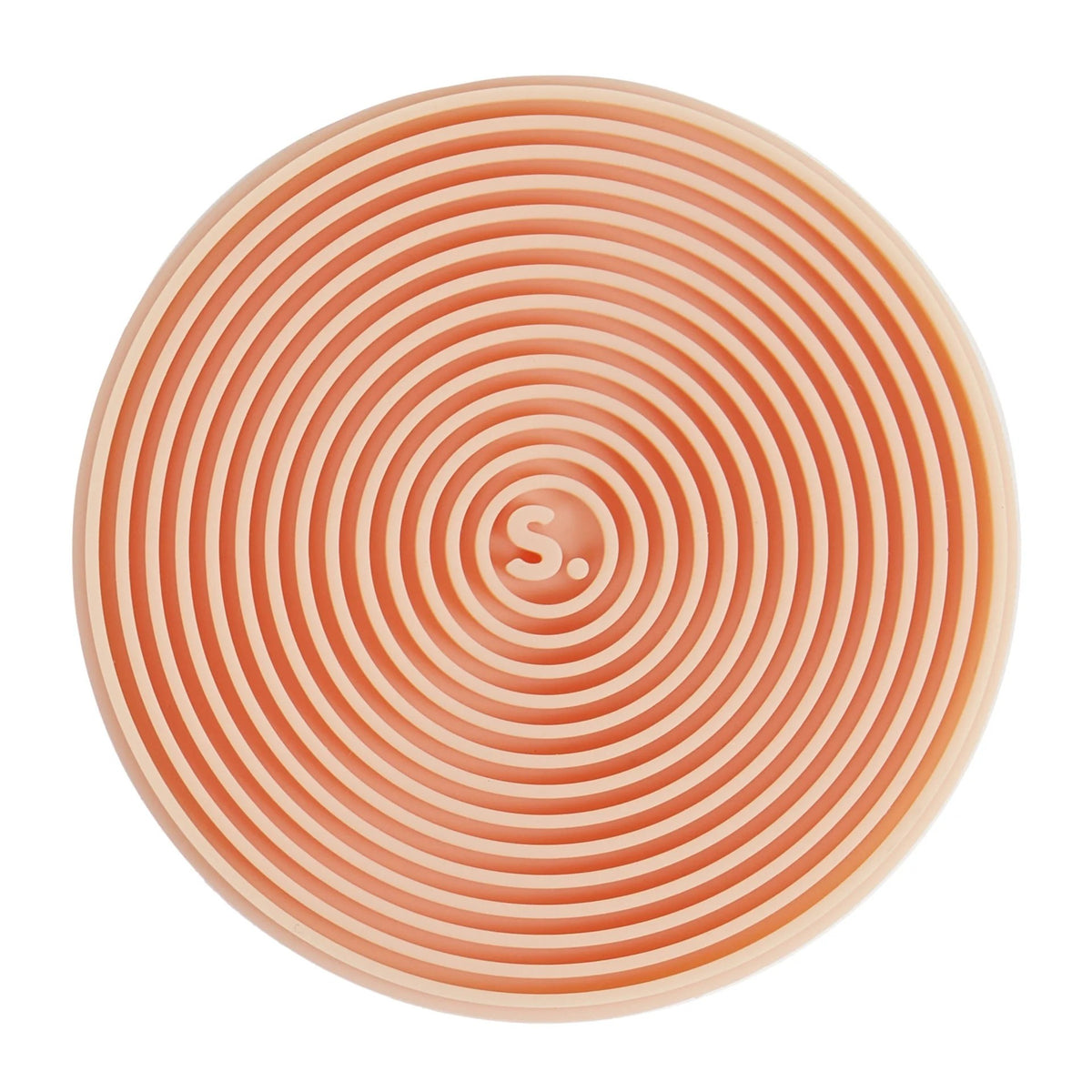 A circular silicone mat with concentric spiral ridges in a peach-orange and cream color scheme, featuring a small 'S' logo in the center for SPEKS.